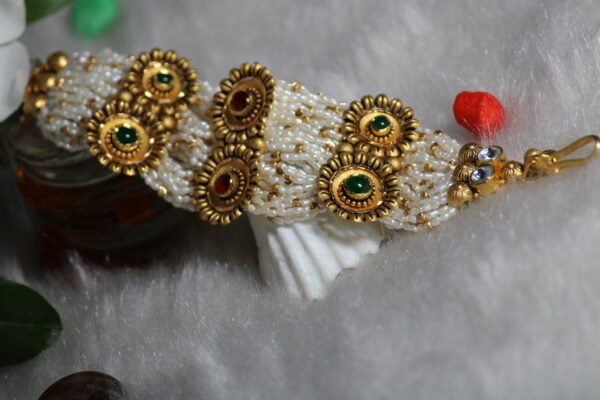 gold necklace with white moti mala