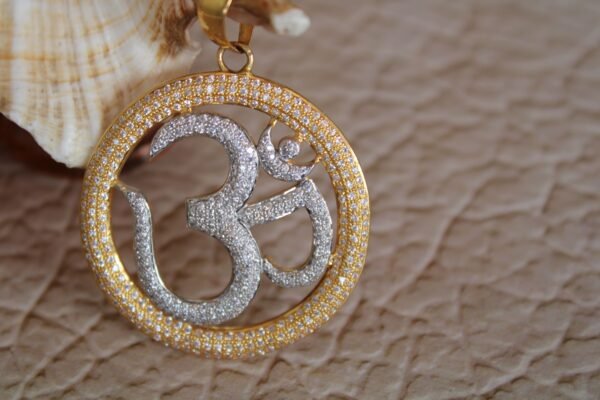 om gold pendent
